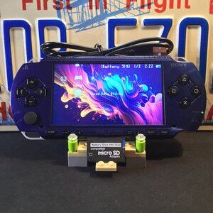 Sony PSP 1001 with Charger, Memory Stick, & Games